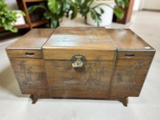 An oriental carved camphor wood blanket chest,