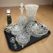 A crystal vase, decanter with stopper, tea cups, a turned hard stone lamp base, etc.