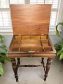 A continental mahogany work table with compartmentalised interior,