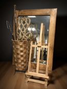 A contemporary pine mirror, 93 cm x 68 cm, together with a small easel,