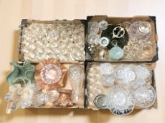 A large quantity of drinking glasses, decanters, carnival glass bowls, etc.