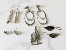 A silver and marcasite penguins brooch and four pairs of earrings