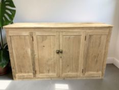 A Victorian pine four door school cupboard, 187 cm x 59 cm x 108 cm.