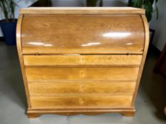 An early 20th century continental oak and satinwood inlaid cylinder front secretaire bureau,