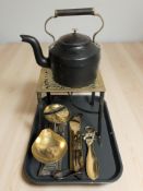 A Georgian brass and steel trivet, together with a kettle, set of scales with graduated weights,