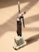 After Demétre Chiparus : A cold painted metal and celluloid figure of a flapper girl,