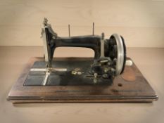 An antique hand sewing machine.