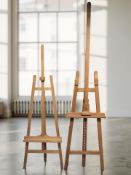 Two folding wooden easels