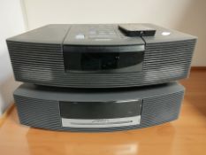 A Bose Wave music system AWRCC5, a further Wave radio / CD AWRC3G, with leads and a remote controls.