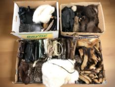 A collection of furs including many fox and ferret stoles, lady's vintage handbags, other clothing.
