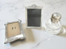 An Edwardian silver easel photo frame, Birmingham 1911, height 17cm,