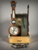 A wooden crate containing mahogany barometer, continental wall clock, mangleboard, etc.