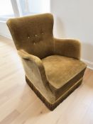 A 20th century armchair in buttoned olive fabric.
