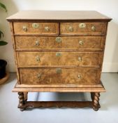 A Queen Anne figured walnut chest on stand, circa 1700,