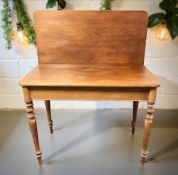 A walnut turnover top tea table,