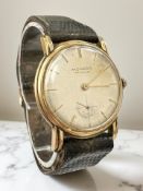 A gent's 18ct gold wristwatch signed Movado, Fab Suisse, silvered dial with subsidiary seconds,
