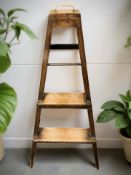 An early 20th century oak bookcase step,