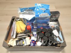 New tins of vehicle spray paint, screen protectors, ice scrapers, chamois cloths, etc.
