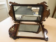 A George III walnut fret cut mirror and a further mahogany and parcel gilt mirror,