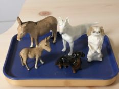 A Beswick donkey and foal, a Beswick dachshund and two Royal Copenhagen dogs, No. 3280 and 1776.