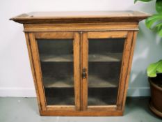 An early 20th century glazed oak bookcase top,