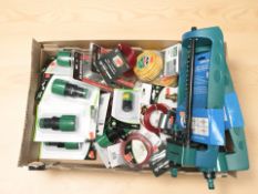 Assorted new garden hose connectors, spools of strimmer line, sprinklers, etc.