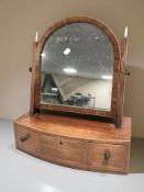 A Victorian mahogany and satinwood inlaid bow-front dressing table mirror, fitted three drawers,