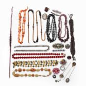 A jewellery box containing a collection of antique and vintage costume jewellery,