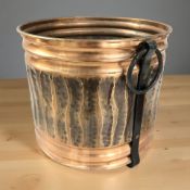 A copper effect twin handled circular coal bin, width 35 cm.