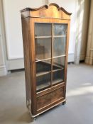 A 19th century continental walnut and pine glazed single door bookcase, 78 cm x 27 cm x 174 cm.