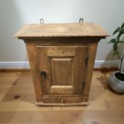 A 19th century continental oak single door wall cabinet width 60 cm