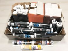 A quantity of tubes of silicon, sealant and filler.