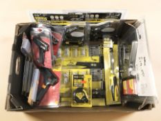 Assorted new staple guns, tape measures, glue guns.