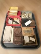 A group of razors and packs of blades, lighter, leather cigarette case, assorted buttons and studs,