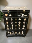 A reproduction Japanese black lacquered and hard stone inlaid chest,