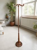 A Regency style carved mahogany wig and coat stand,