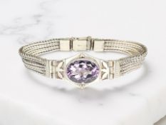 A silver and amethyst herringbone-link bracelet, length 19cm CONDITION REPORT: 30.