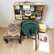 An early 20th century stool, a concertina sewing box, vintage luggage case,
