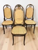 A set of four Thonet bentwood and cane high backed dining chairs.