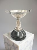 A small silver twin-handled cup on stand, Reid & Sons, London 1870, overall 11cm high.