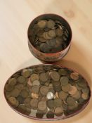 Two tins of British copper coins.