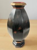 A lacquered wooden hexagonal vase, height 51 cm.