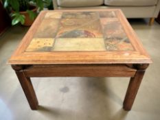 A reproduction Scandinavian oak coffee table with tiled and brass inset top,