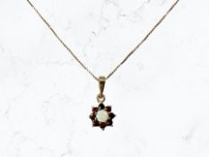 A 9ct gold opal and garnet cluster pendant on chain CONDITION REPORT: 1.