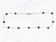 A gold and cultured pearl necklace stamped 14K, length 40cm CONDITION REPORT: 5.