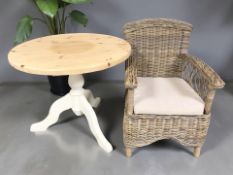 A reproduction painted pine circular pedestal table,