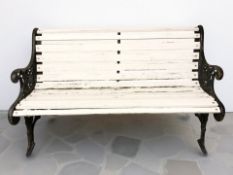 A painted cast iron framed garden bench,