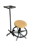 A swivel stool and an industrial style occasional stand in the form of lengths of pipe