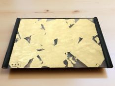 A decorative placemat containing gold leaf, width 38 cm.