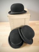 A gent's black felt bowler hat retailed by Lock & Co, St.